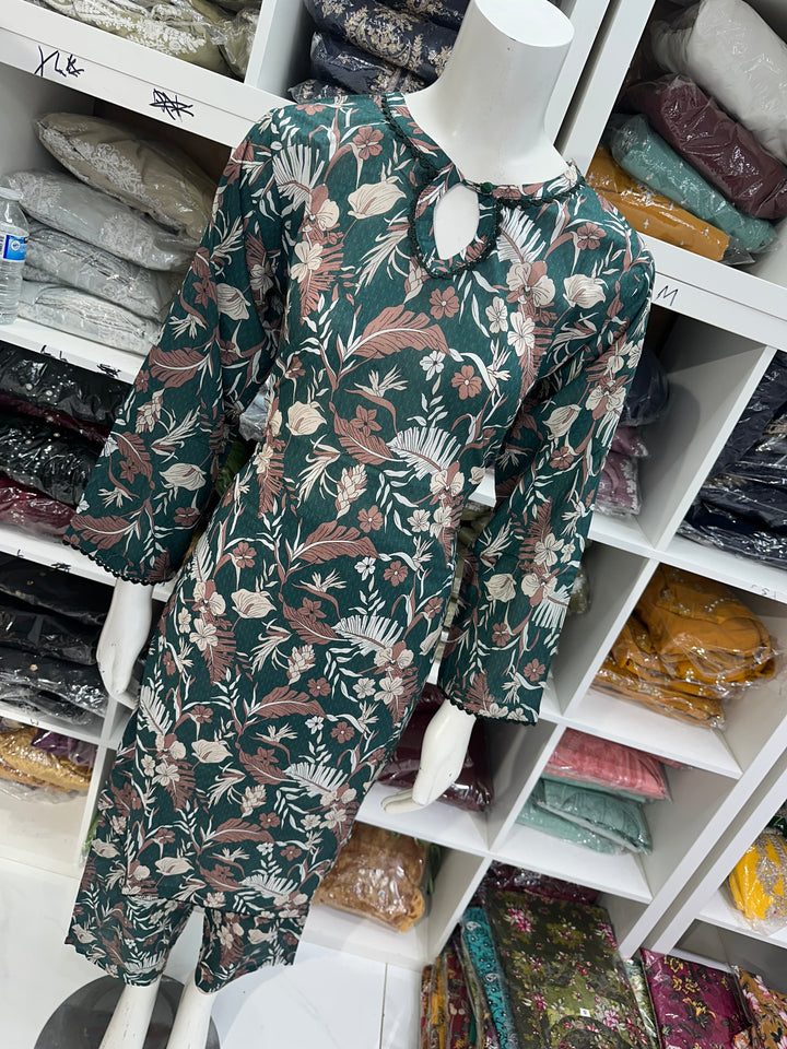 Two piece lawn material suits on offer