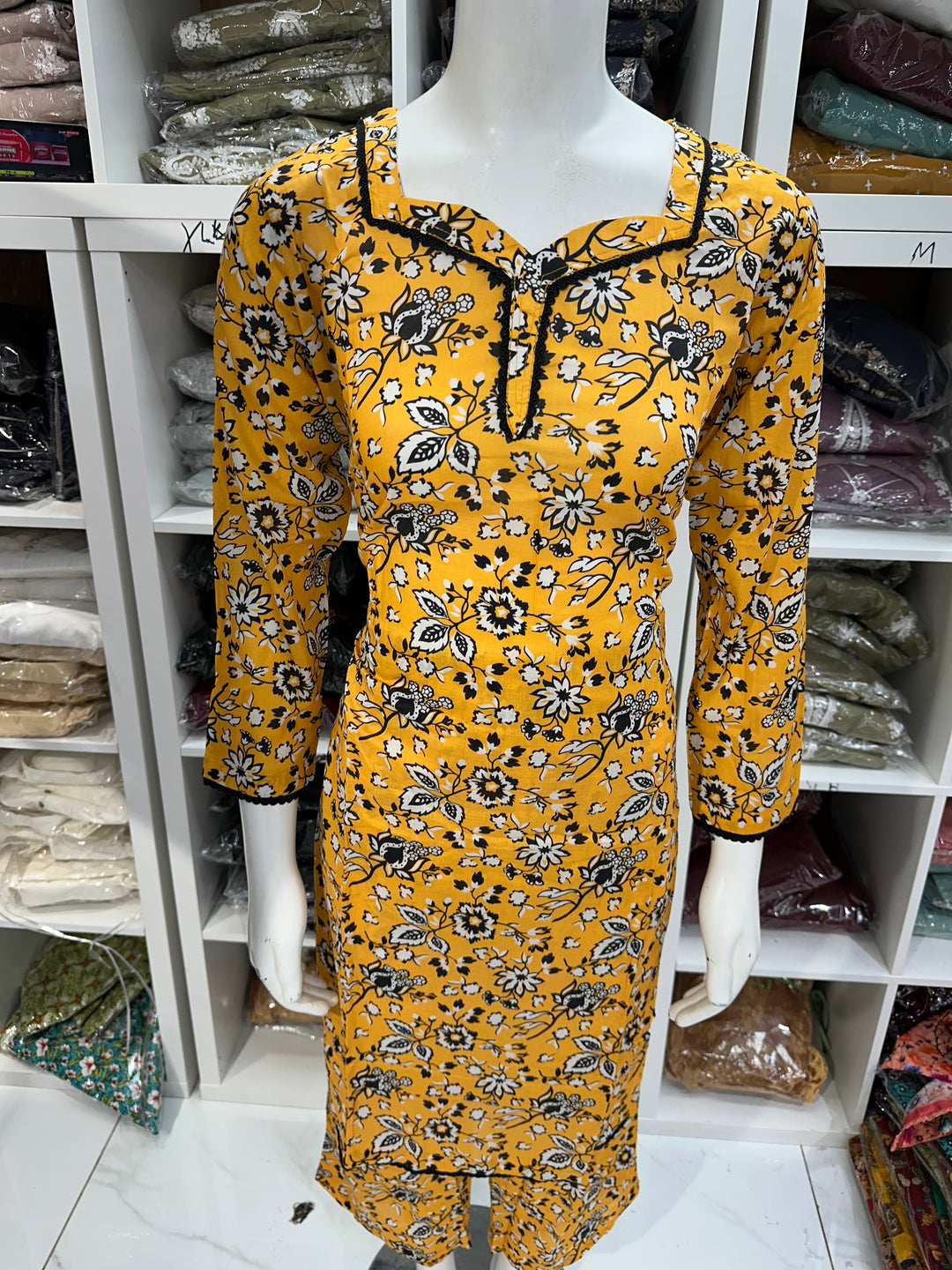 Two piece lawn material suits on offer