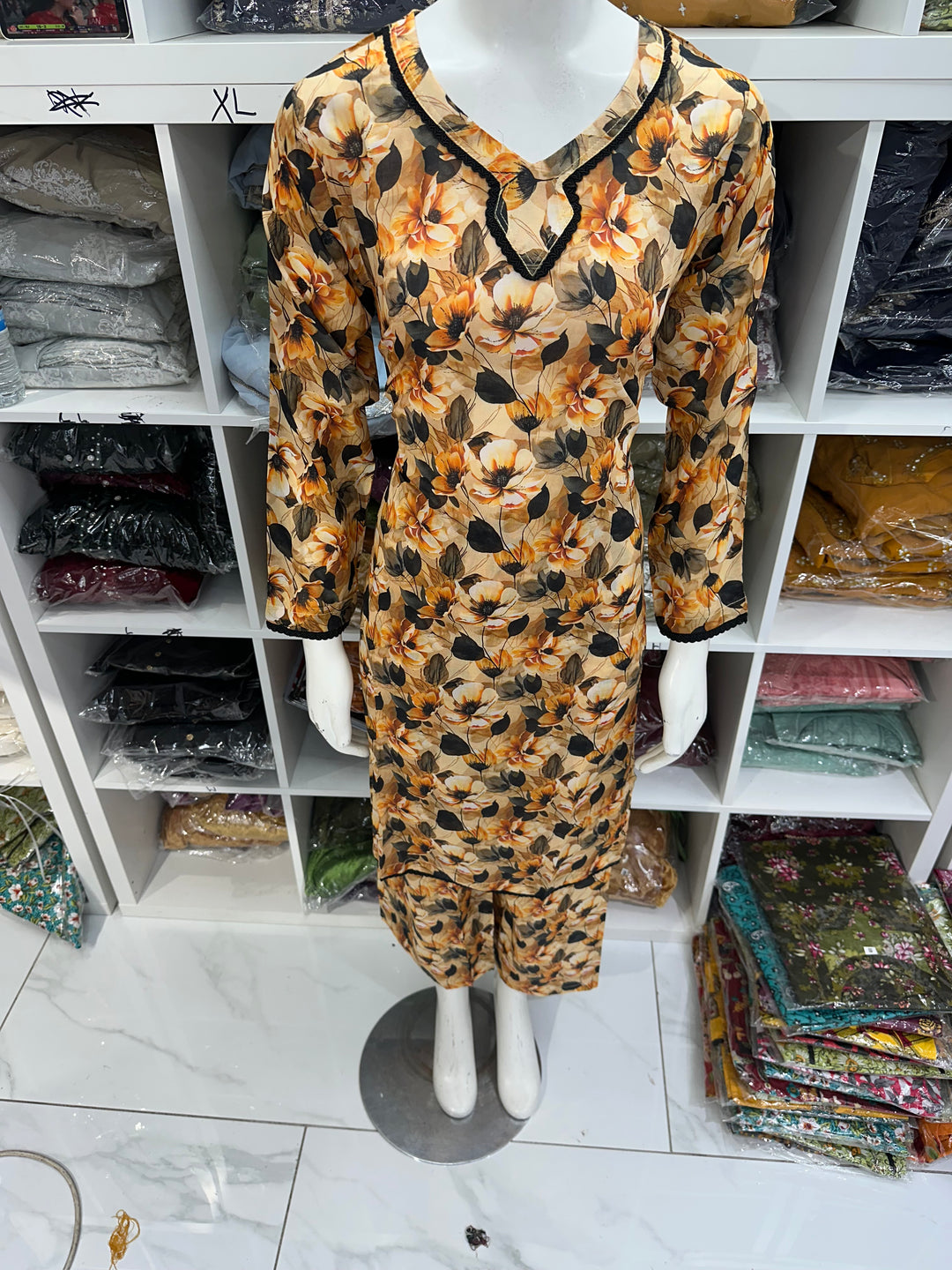 Two piece lawn material suits on offer