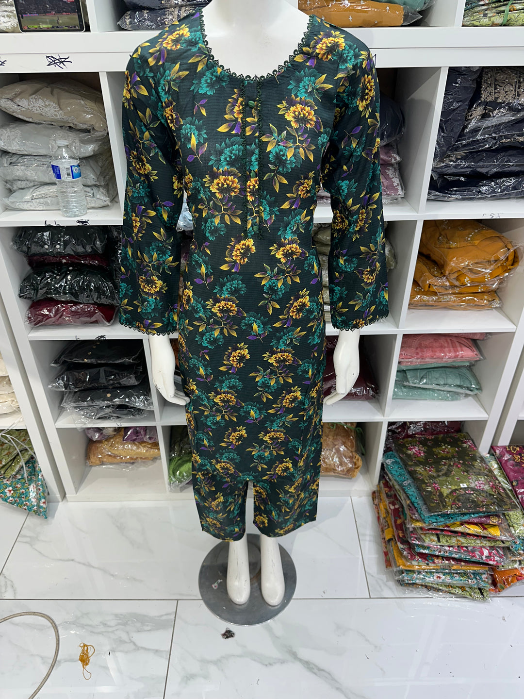 Two piece lawn material suits on offer