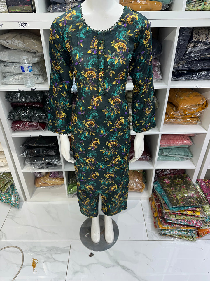 Two piece lawn material suits on offer