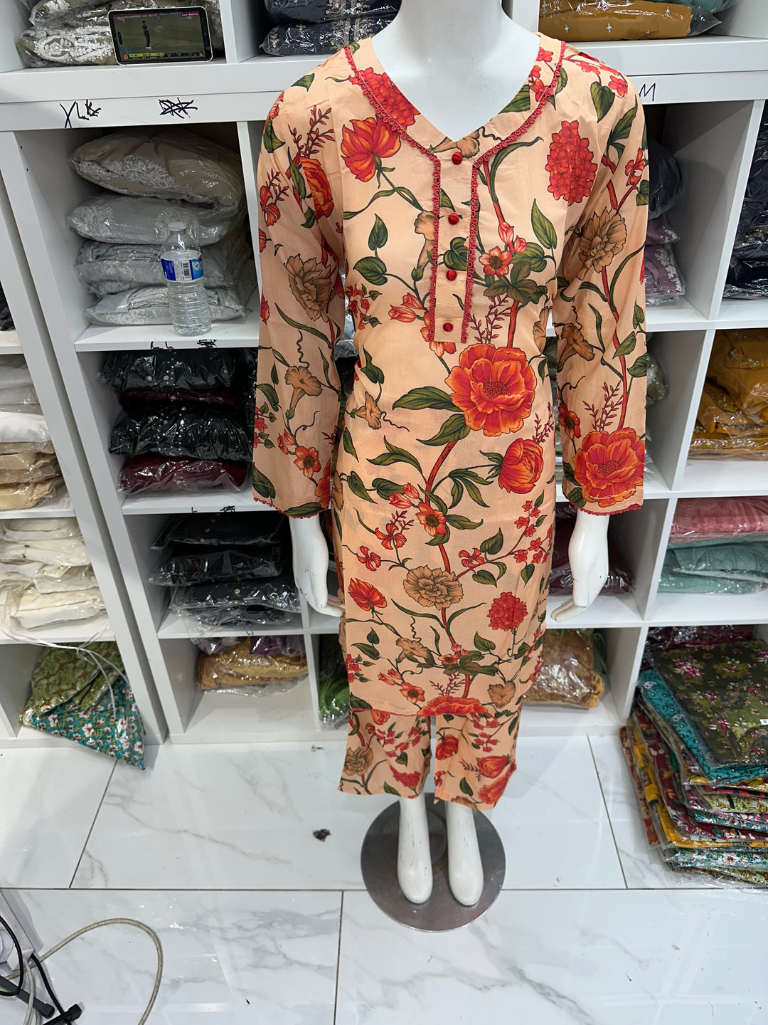 Two piece lawn material suits on offer