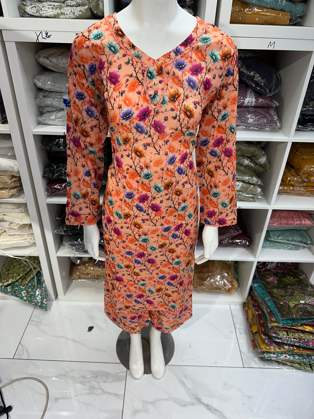 Two piece lawn material suits on offer