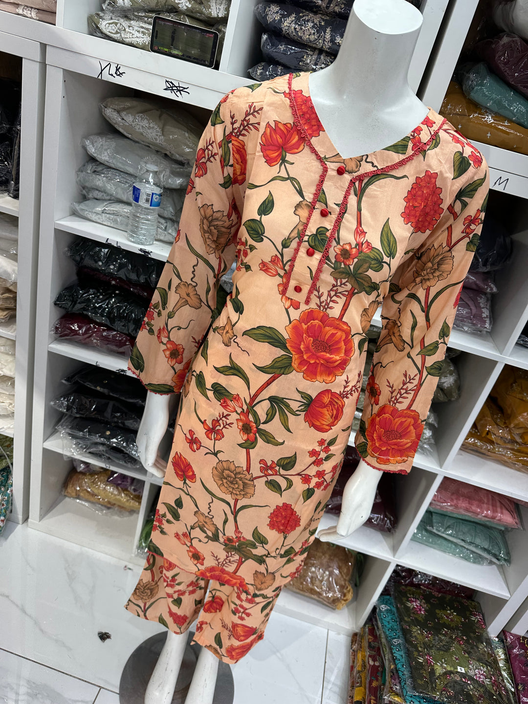 Two piece lawn material suits on offer
