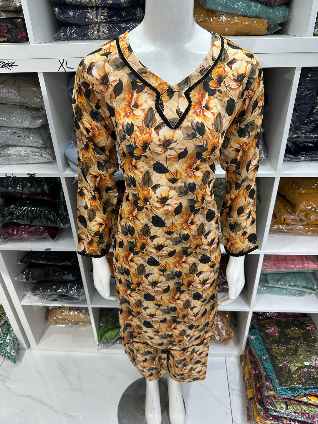 Two piece lawn material suits on offer